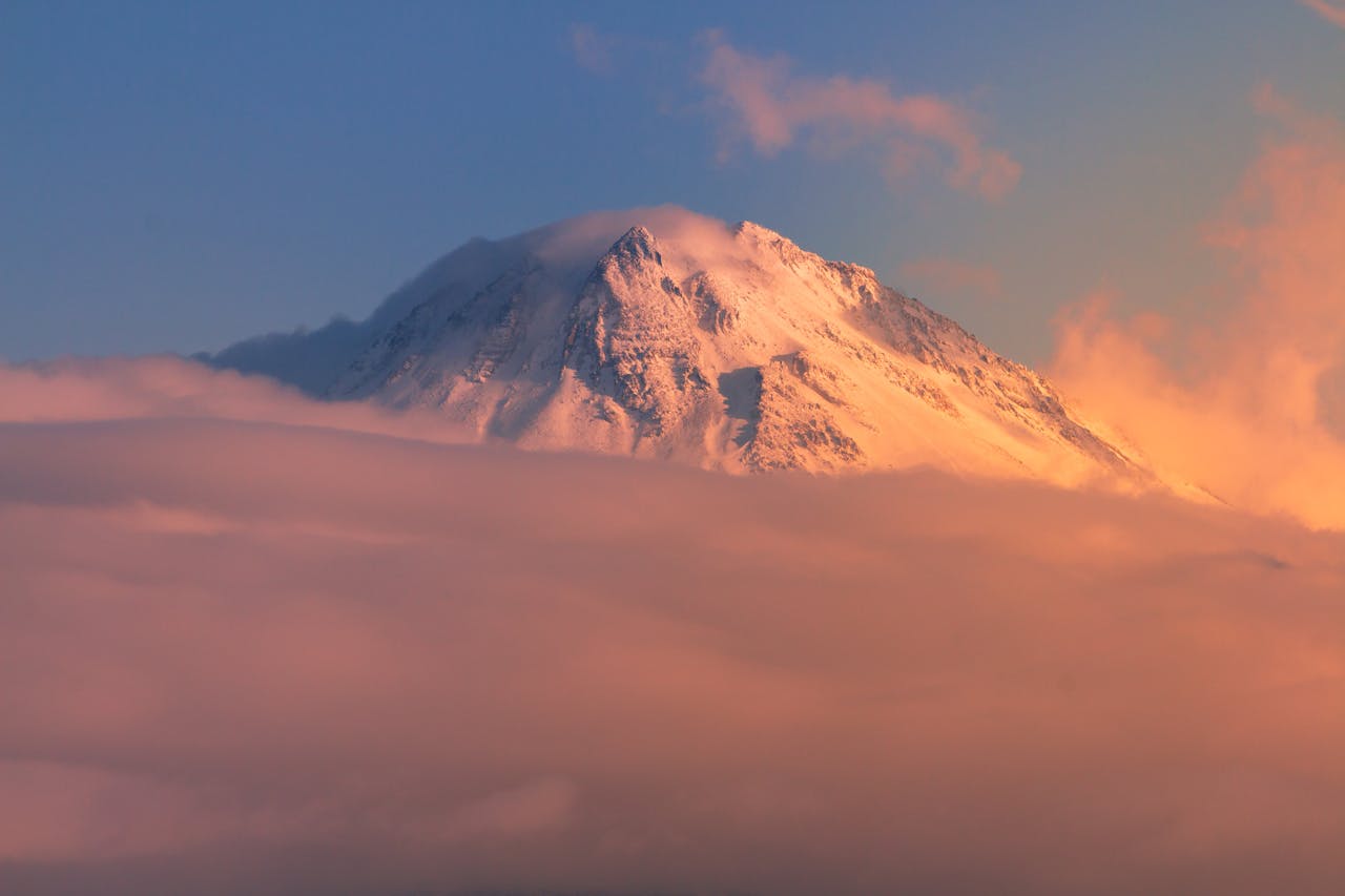 Capture the breathtaking sunset over Mount Hasan, Aksaray, Türkiye, adorned with pink clouds.